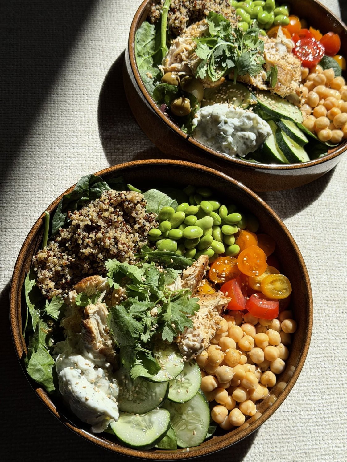 Fresh chicken and quinoa bowls prepared by Bonetti’s Kitchen